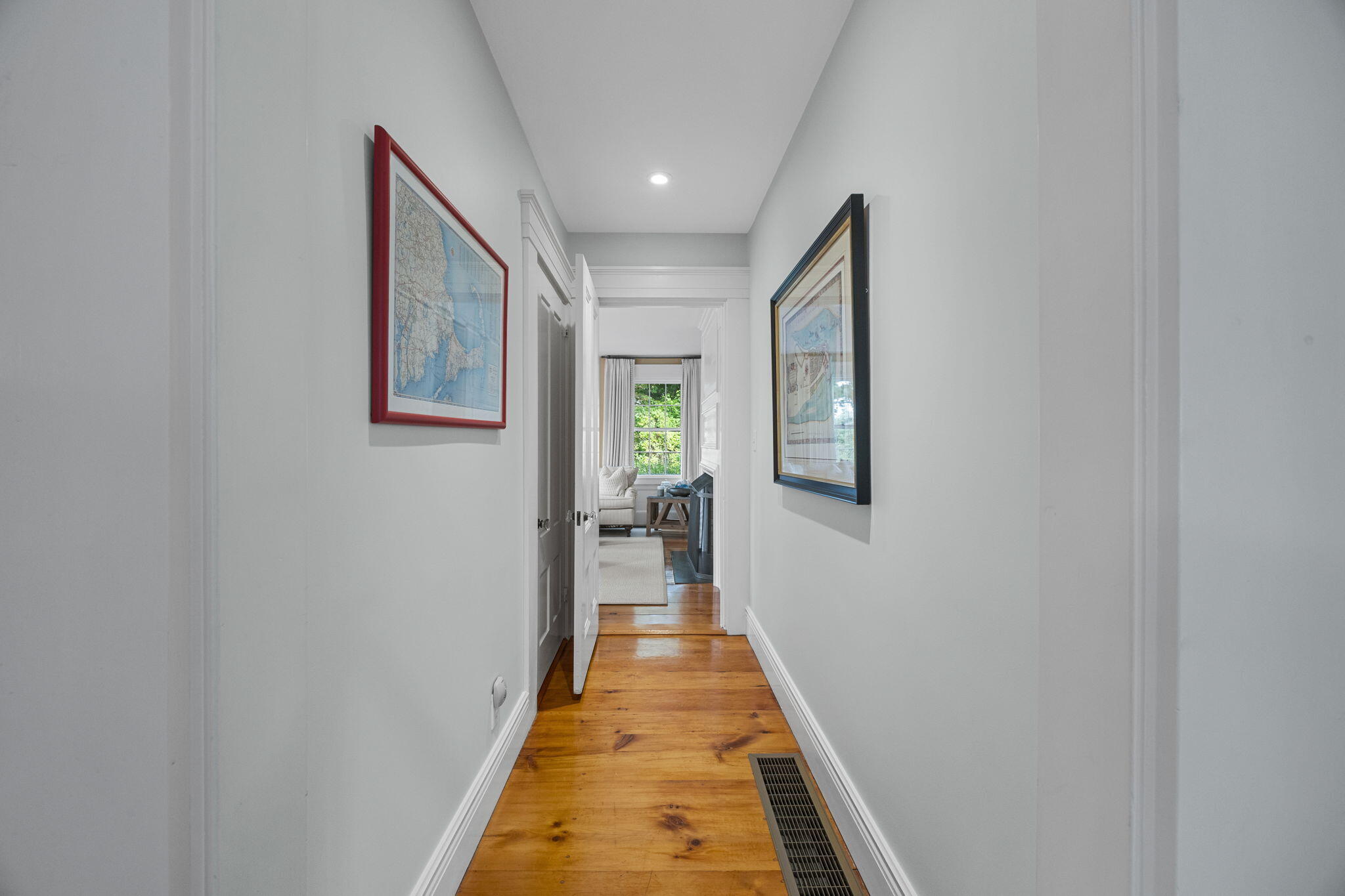 85 Cedar Street Chatham, MA 02633 - Photo 13 of 89 a hallway with wooden floor windows and chandelier