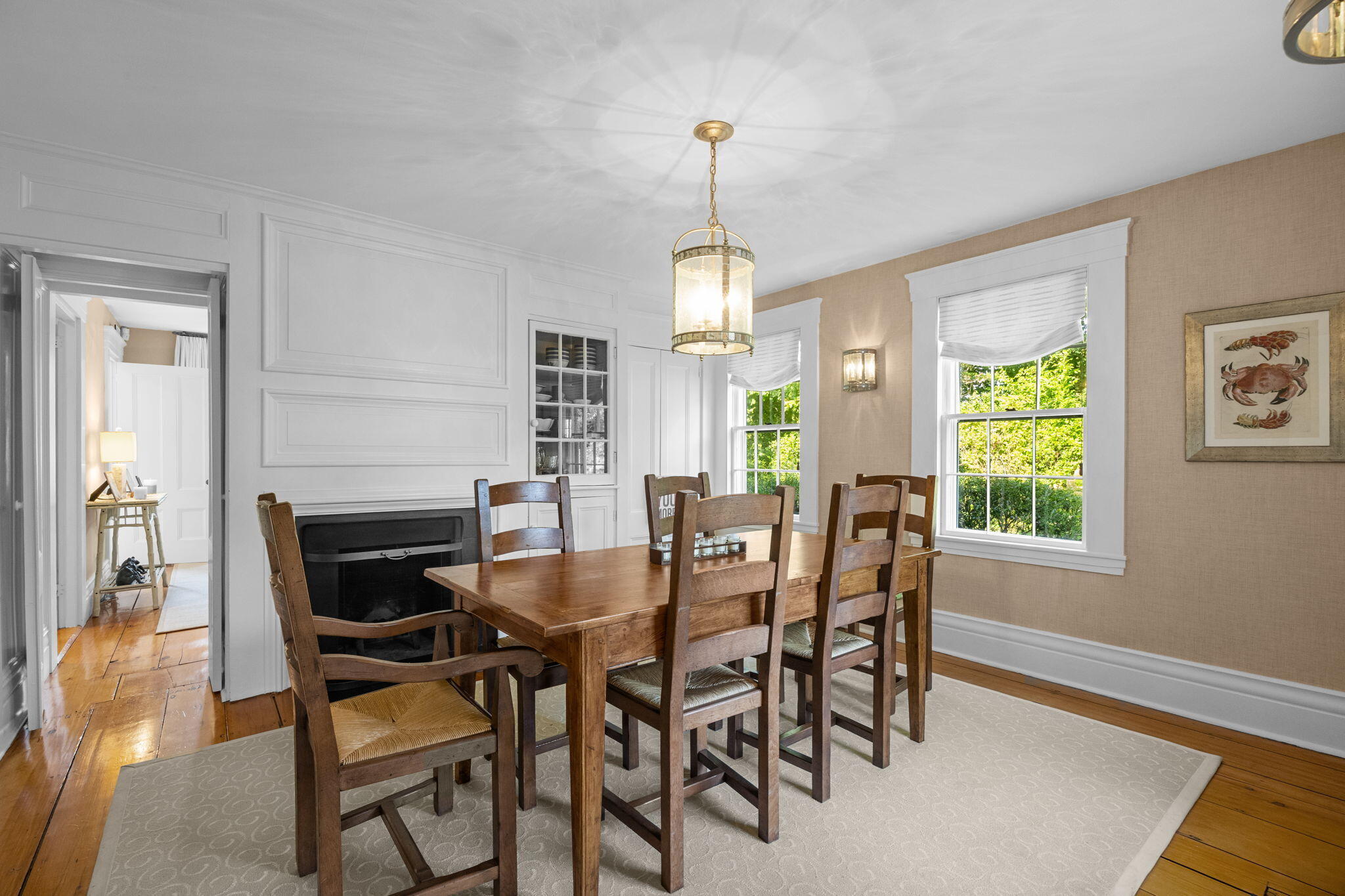 85 Cedar Street Chatham, MA 02633 - Photo 20 of 89 a dining room with furniture a chandelier and wooden floor