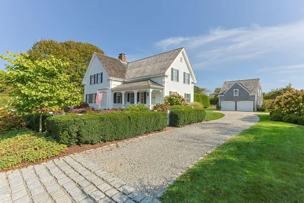 a view of front of house with a yard