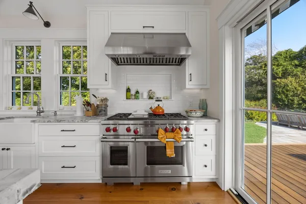 a bedroom with two beds and a window