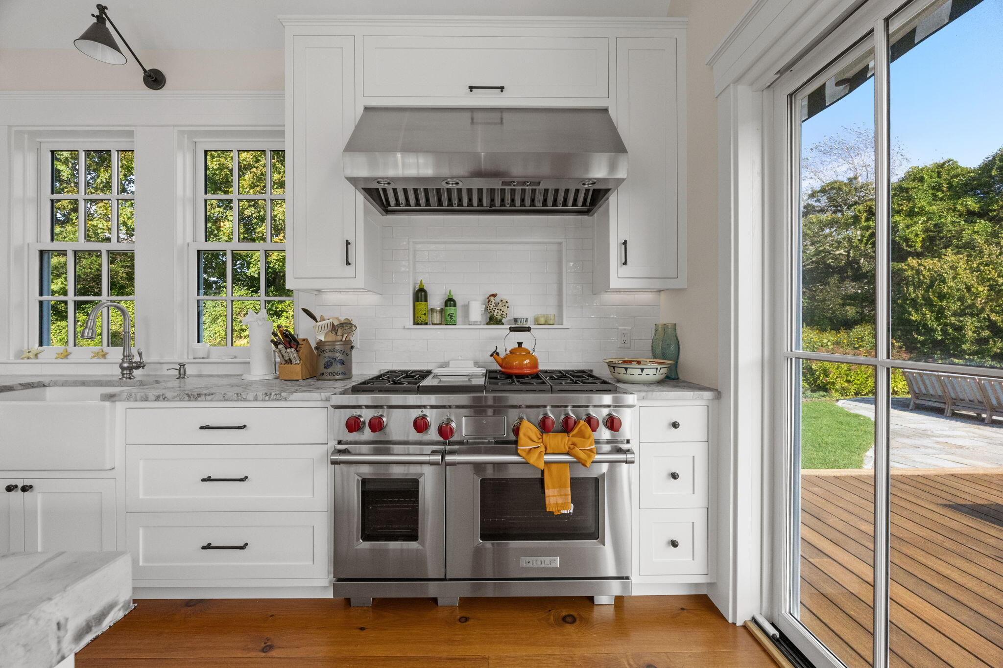 85 Cedar Street Chatham, MA 02633 - Photo 24 of 89 a kitchen with a stove a sink and a window