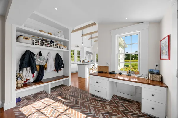 a kitchen with sink stove and wooden floor