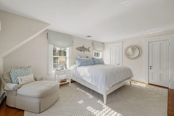 a bathroom with a window and a shower