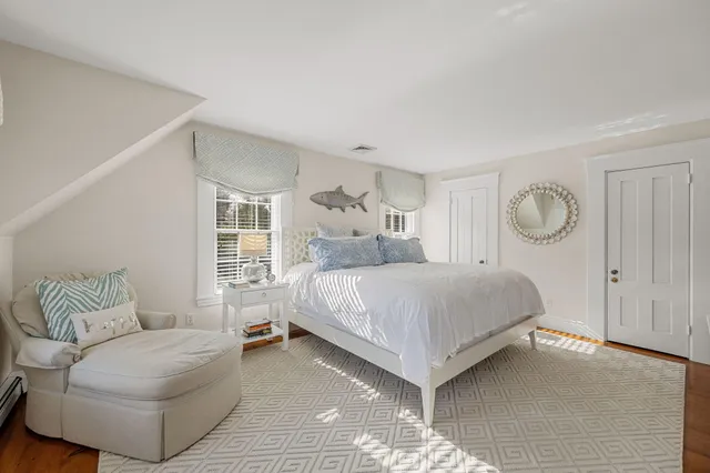 a bathroom with a window and a shower