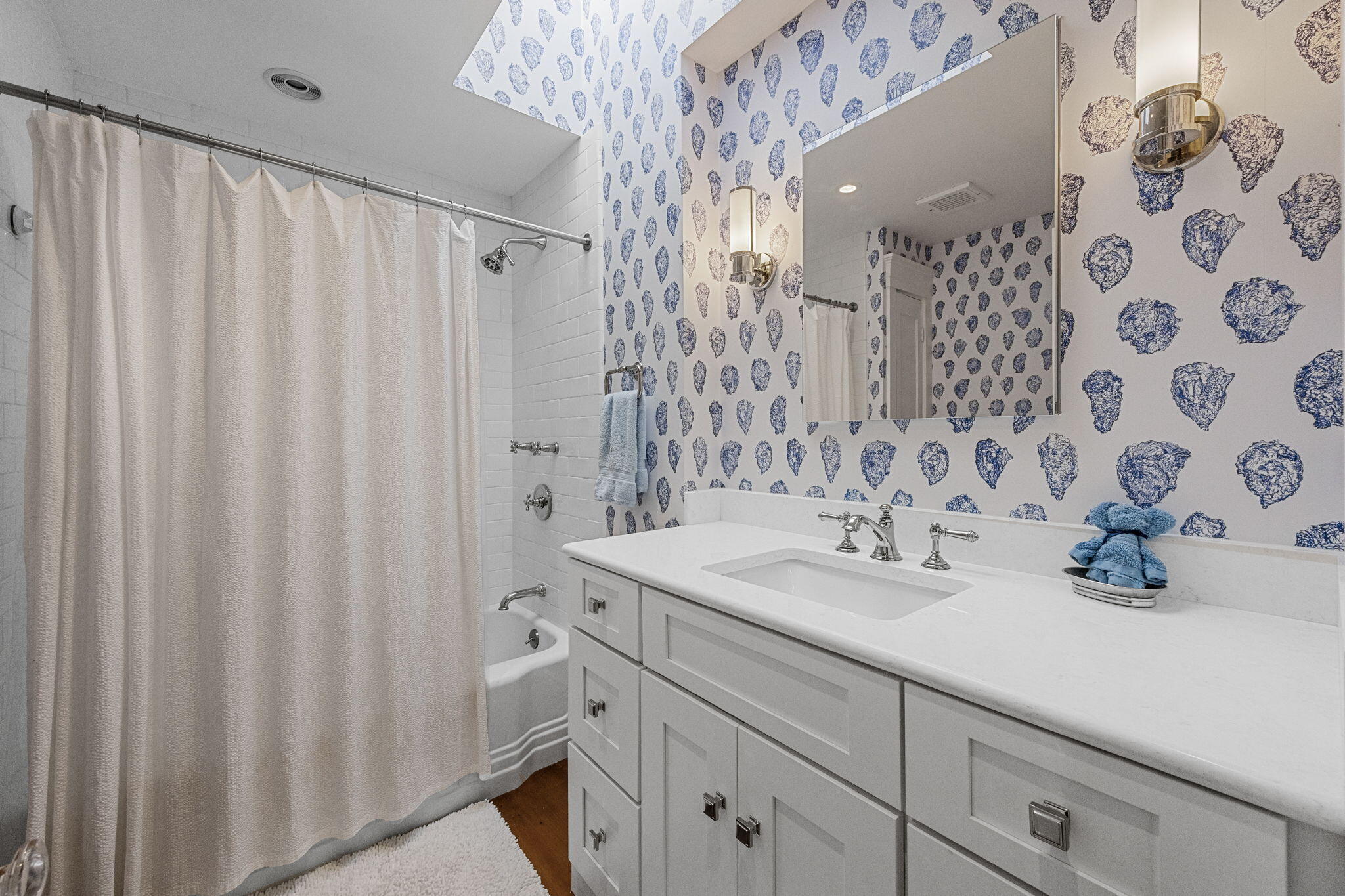 85 Cedar Street Chatham, MA 02633 - Photo 38 of 89 a bathroom with a sink and a mirror