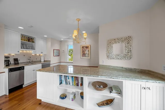 a aerial view of a house with swimming pool and a yard