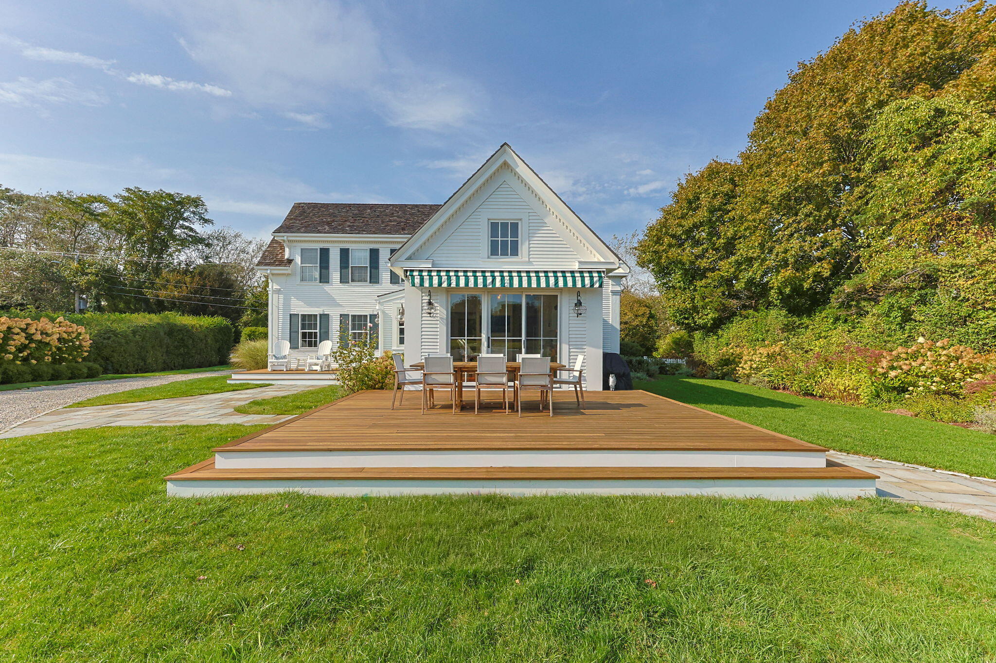 85 Cedar Street Chatham, MA 02633 - Photo 62 of 89 a view of a house with a patio and a yard