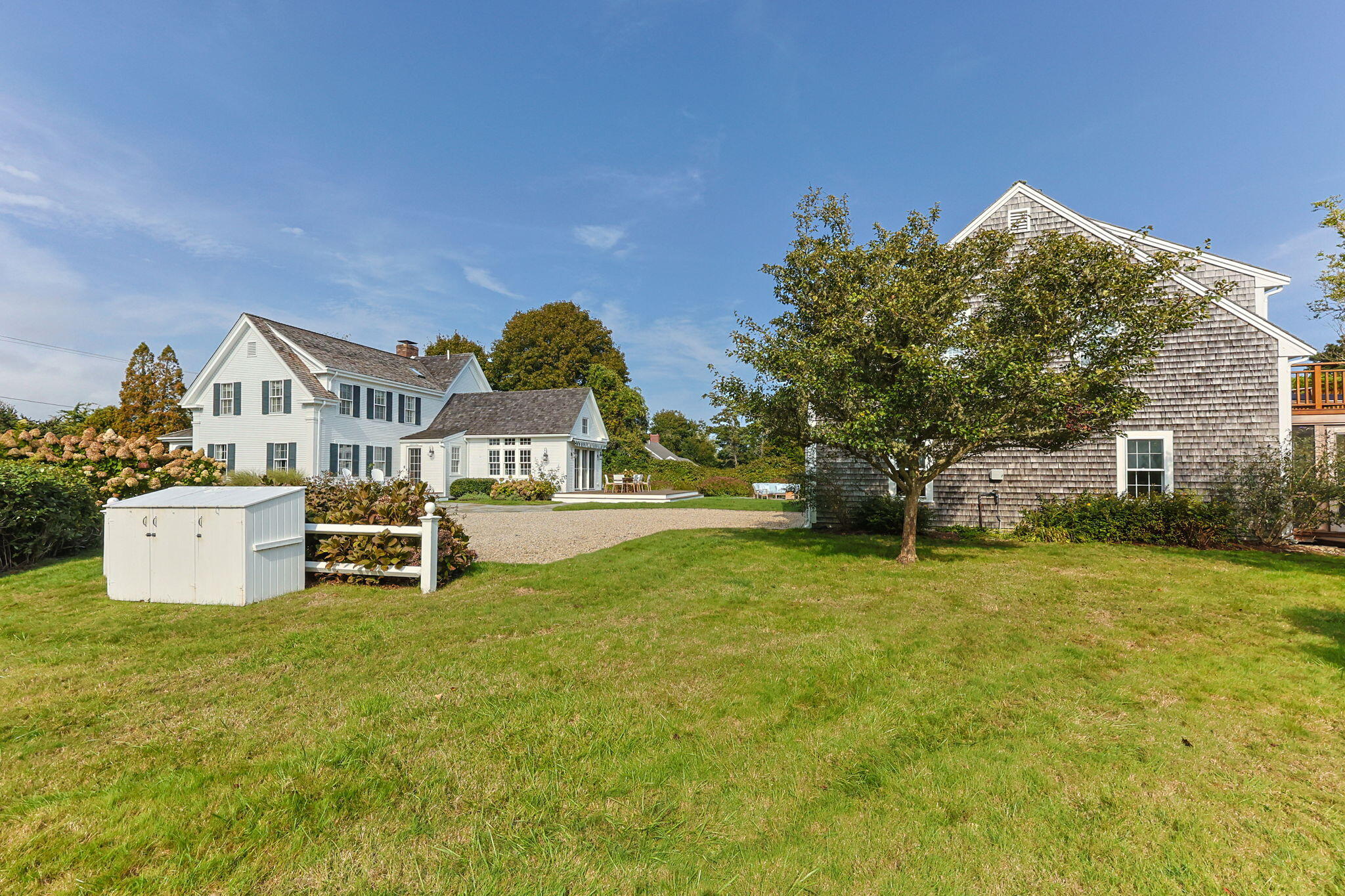 85 Cedar Street Chatham, MA 02633 - Photo 69 of 89 a view of a house with a yard and sitting area