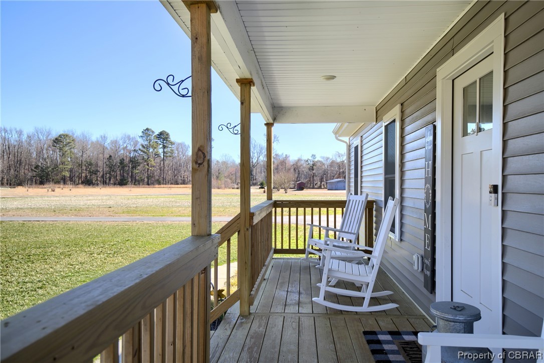 4944 Chestnut Fork Road Gloucester, VA 23061 - Photo 24 of 32 Wooden deck with a lawn
