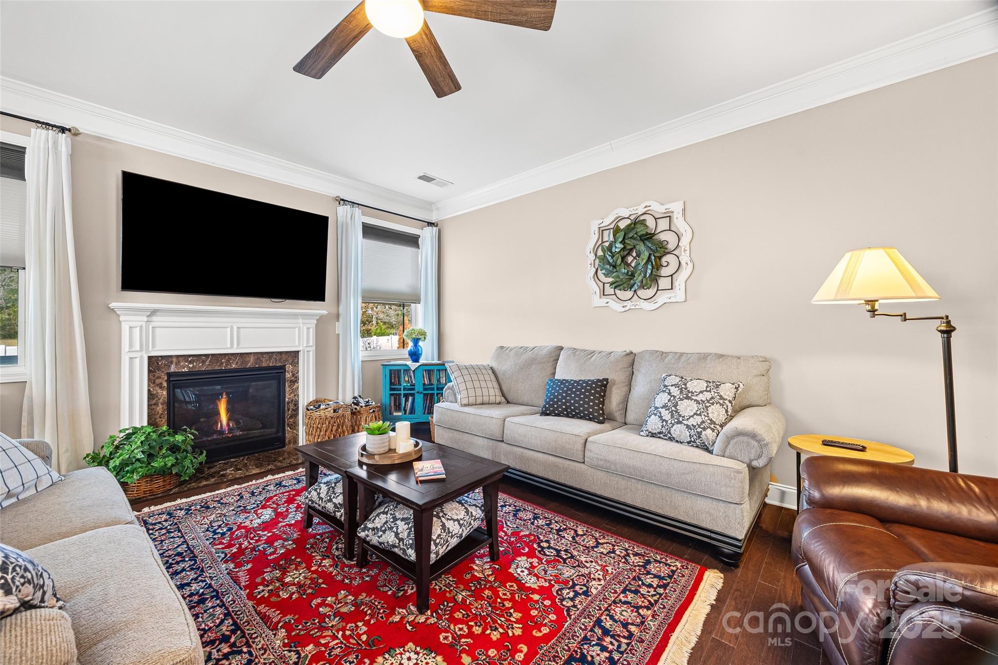 1141 Black Walnut Road Clover, SC 29710 - Photo 15 of 38 a living room with furniture a flat screen tv and a fireplace