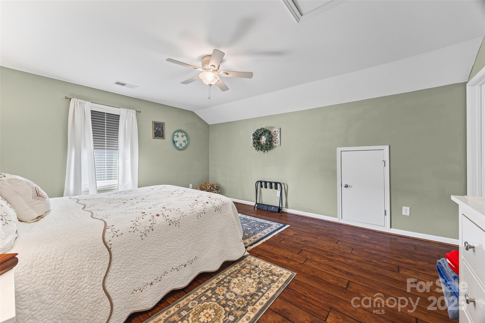 1141 Black Walnut Road Clover, SC 29710 - Photo 24 of 38 a bedroom with a bed and a chandelier
