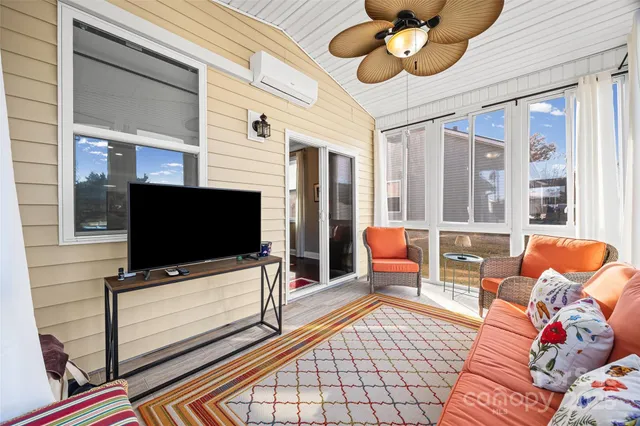 a living room with furniture and a flat screen tv