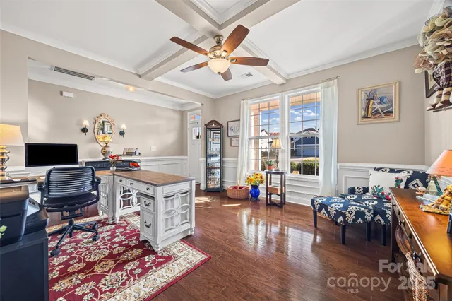 a living room with fireplace furniture and a flat screen tv