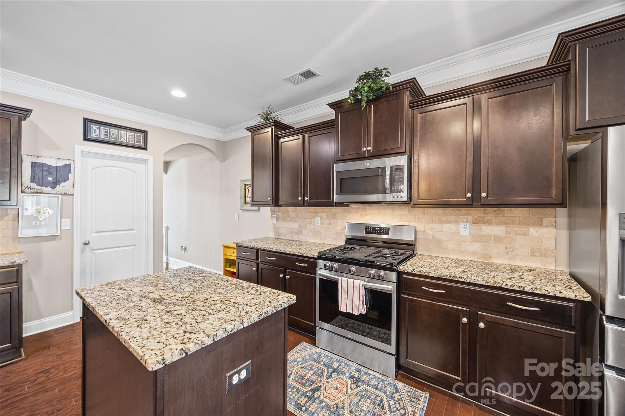 1141 Black Walnut Road Clover, SC 29710 - Photo 9 of 38 a kitchen with stainless steel appliances granite countertop a sink stove and refrigerator
