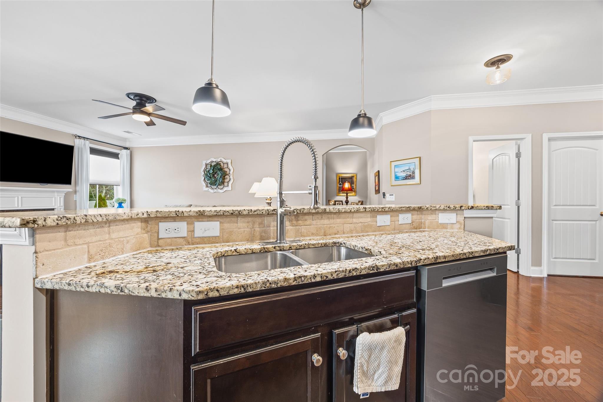 1141 Black Walnut Road Clover, SC 29710 - Photo 10 of 38 a kitchen with a granite countertop sink a stove and a wooden floor