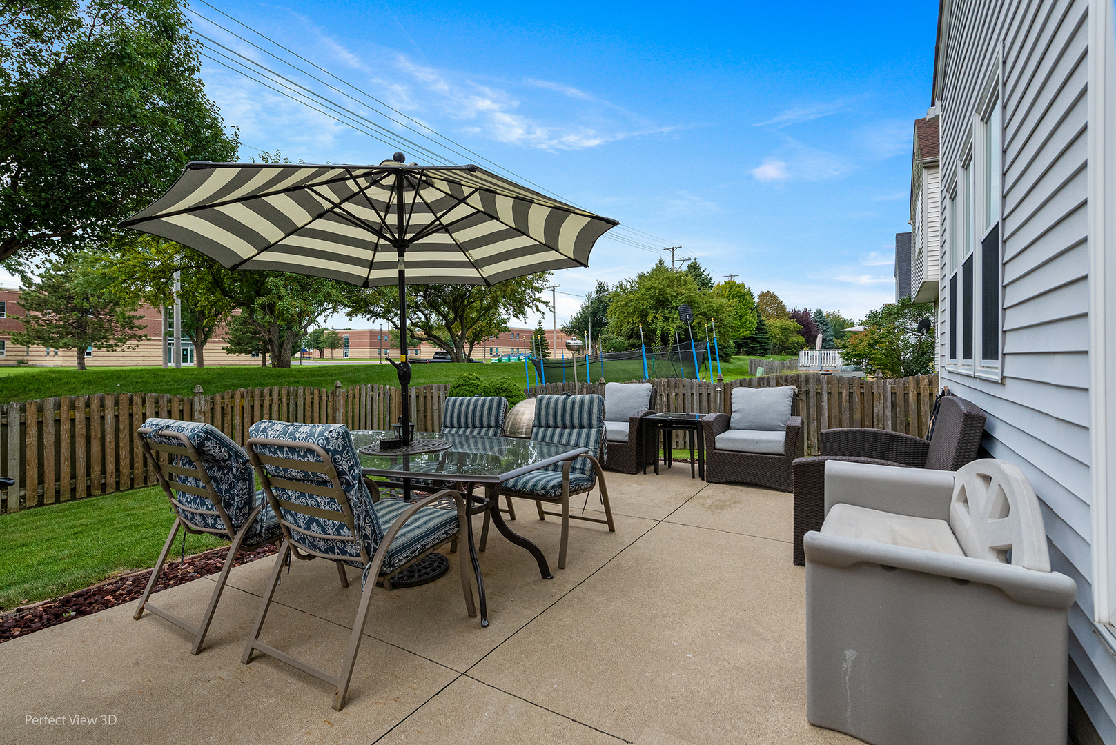 5802 Emerald Pointe Drive Plainfield, IL 60586 - Photo 20 of 28 a view of a chairs and table in the back yard