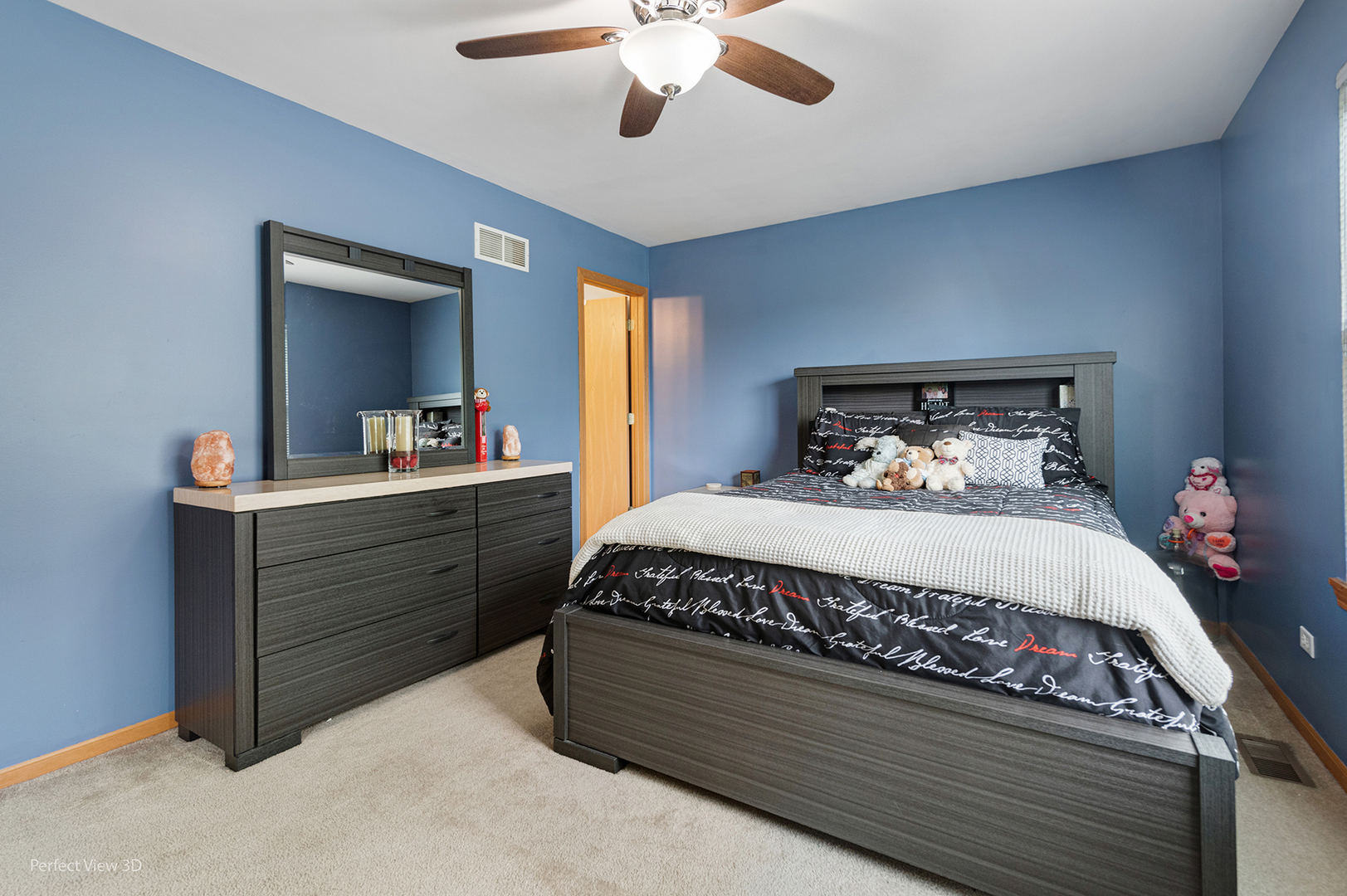 5802 Emerald Pointe Drive Plainfield, IL 60586 - Photo 10 of 28 a bed sitting in a bedroom and dresser