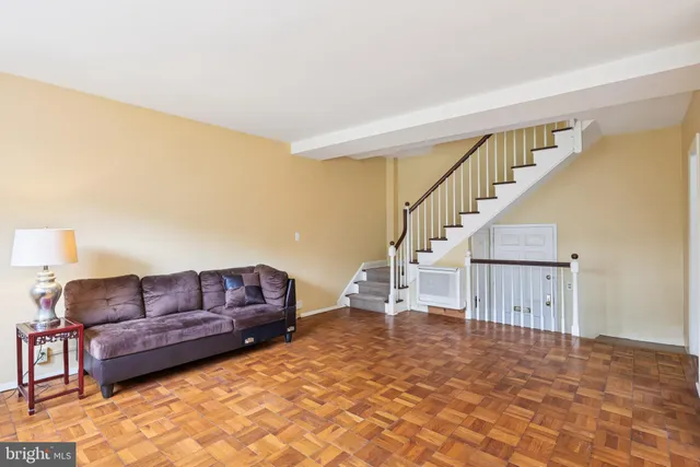 a living room with furniture and a rug