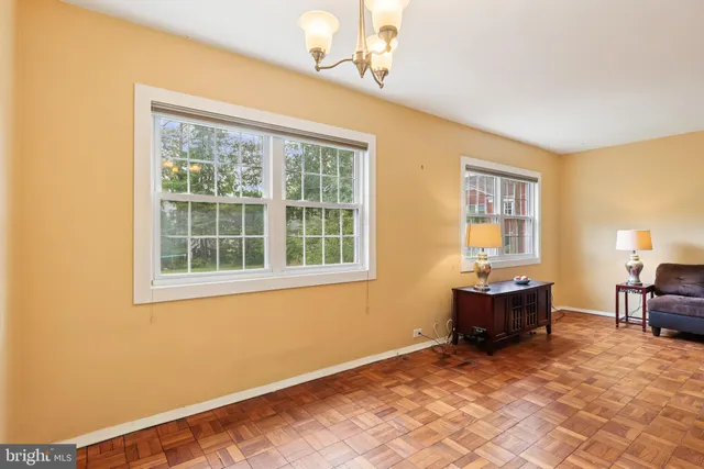 a view of workspace with wooden floor and furniture