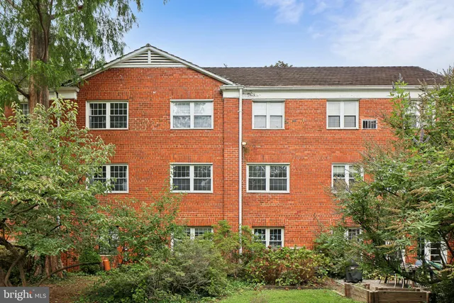 a front view of a house with yard