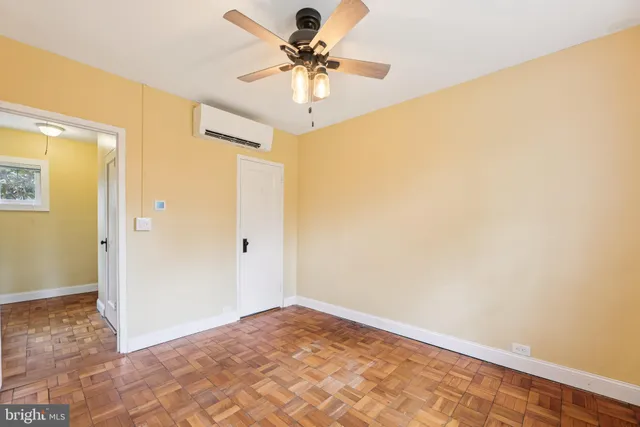 a view of a big room with closet and chandelier fan