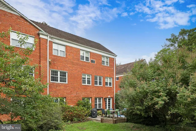 a front view of a building with garden