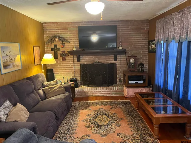 a living room with furniture and a fireplace