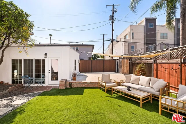 a view of a patio with chairs and a table