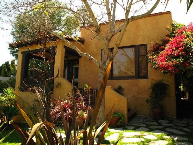 a view of a house with a tree