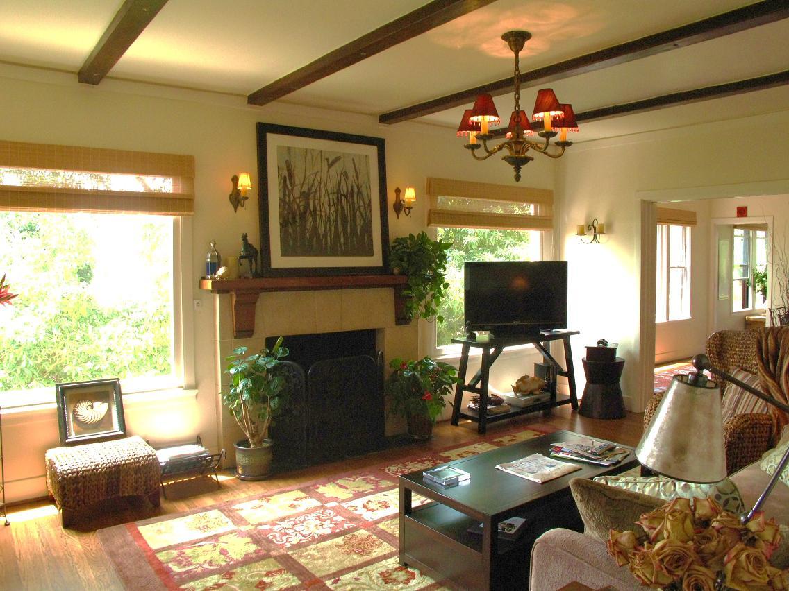 1423 Alta Vista Road Santa Barbara, CA 93103 - Photo 4 of 17 a living room with furniture a flat screen tv and a fireplace