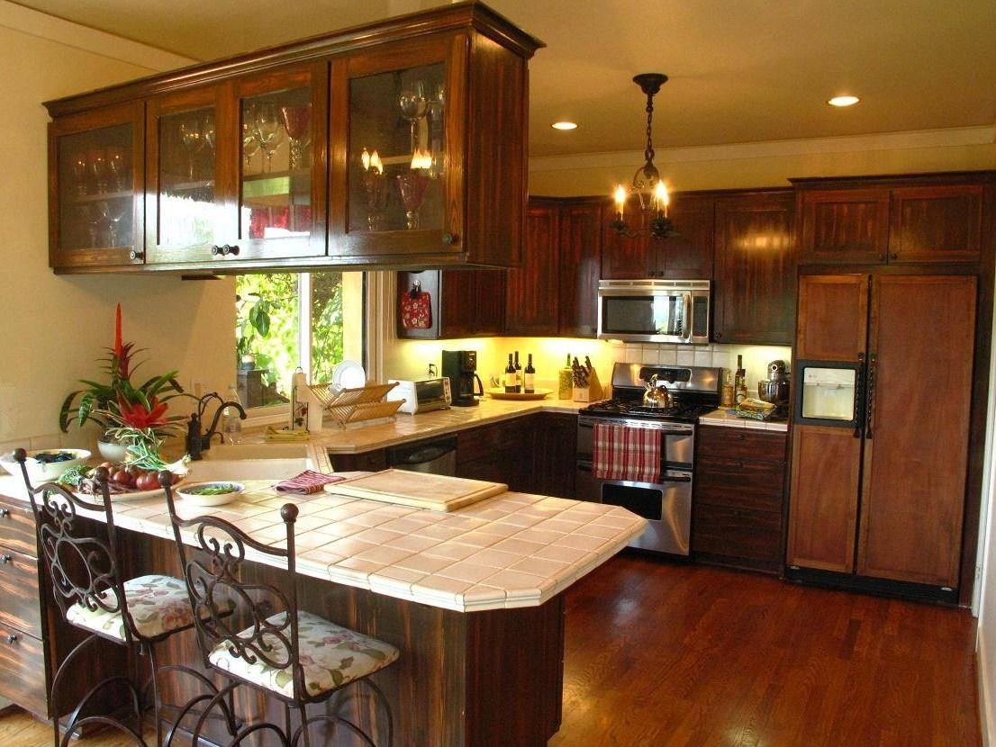 1423 Alta Vista Road Santa Barbara, CA 93103 - Photo 6 of 17 a kitchen with a table and chairs in it