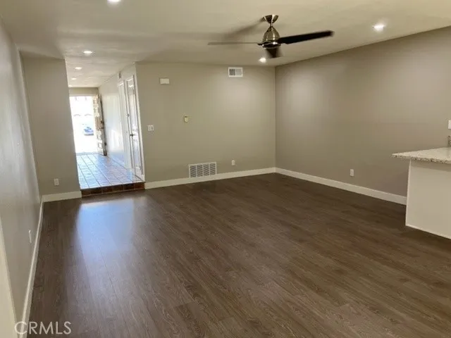 a kitchen with stainless steel appliances a stove top oven a sink and a refrigerator