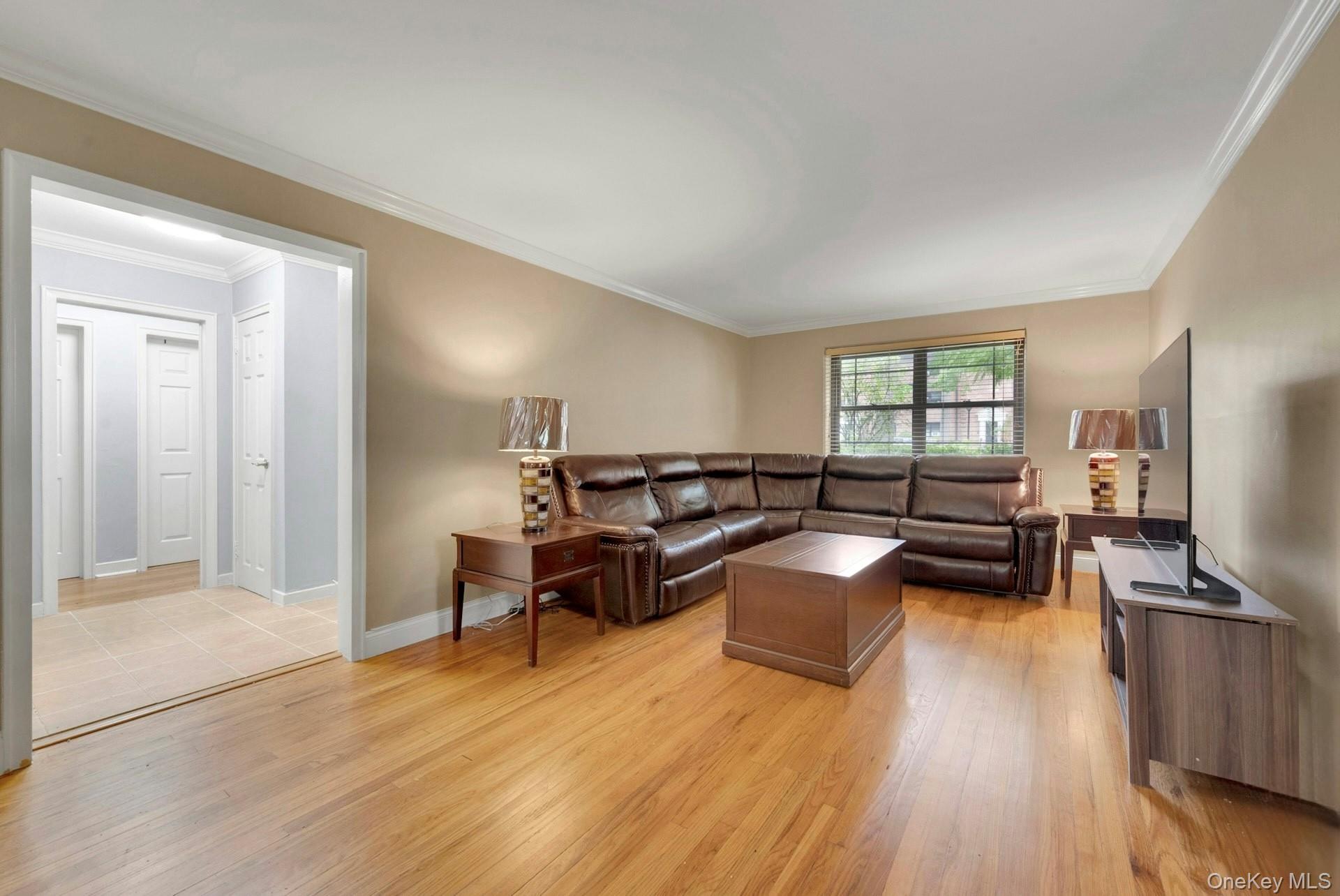 6 Manchester Road, Unit 1 Eastchester, NY 10709 - Photo 11 of 40 Living area with ornamental molding and light wood-type flooring