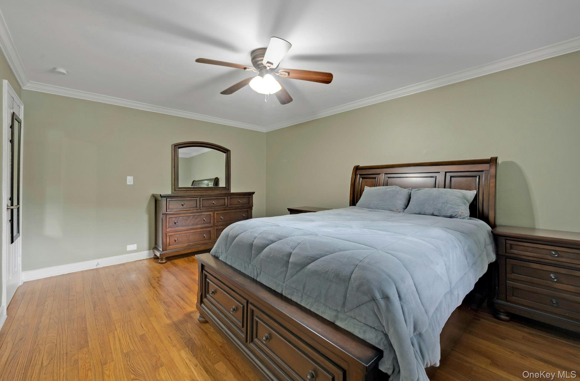 6 Manchester Road, Unit 1 Eastchester, NY 10709 - Photo 25 of 40 Bedroom featuring crown molding, wood finished floors, and ceiling fan