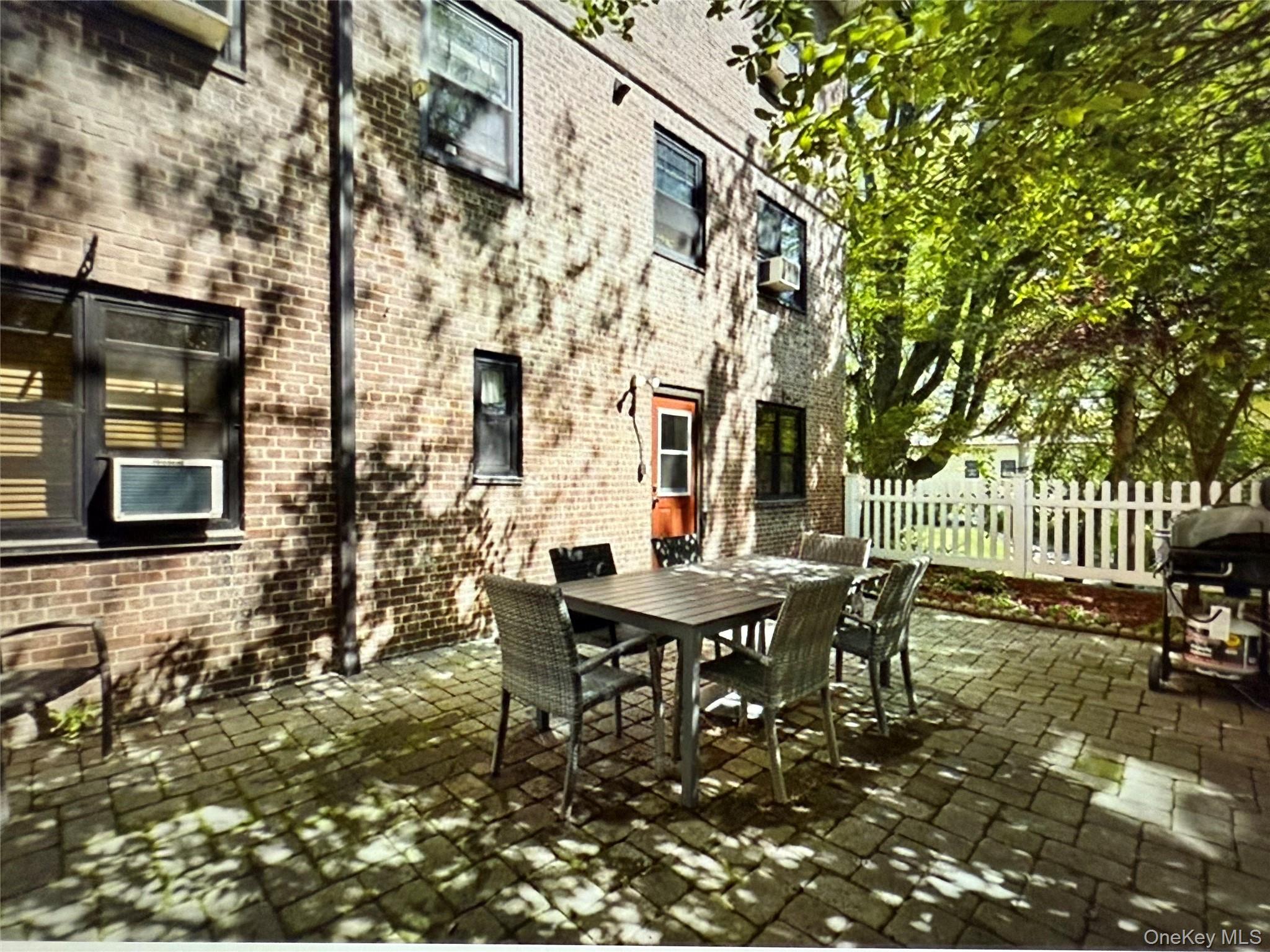 6 Manchester Road, Unit 1 Eastchester, NY 10709 - Photo 27 of 40 View of patio / terrace featuring outdoor dining space and a grill