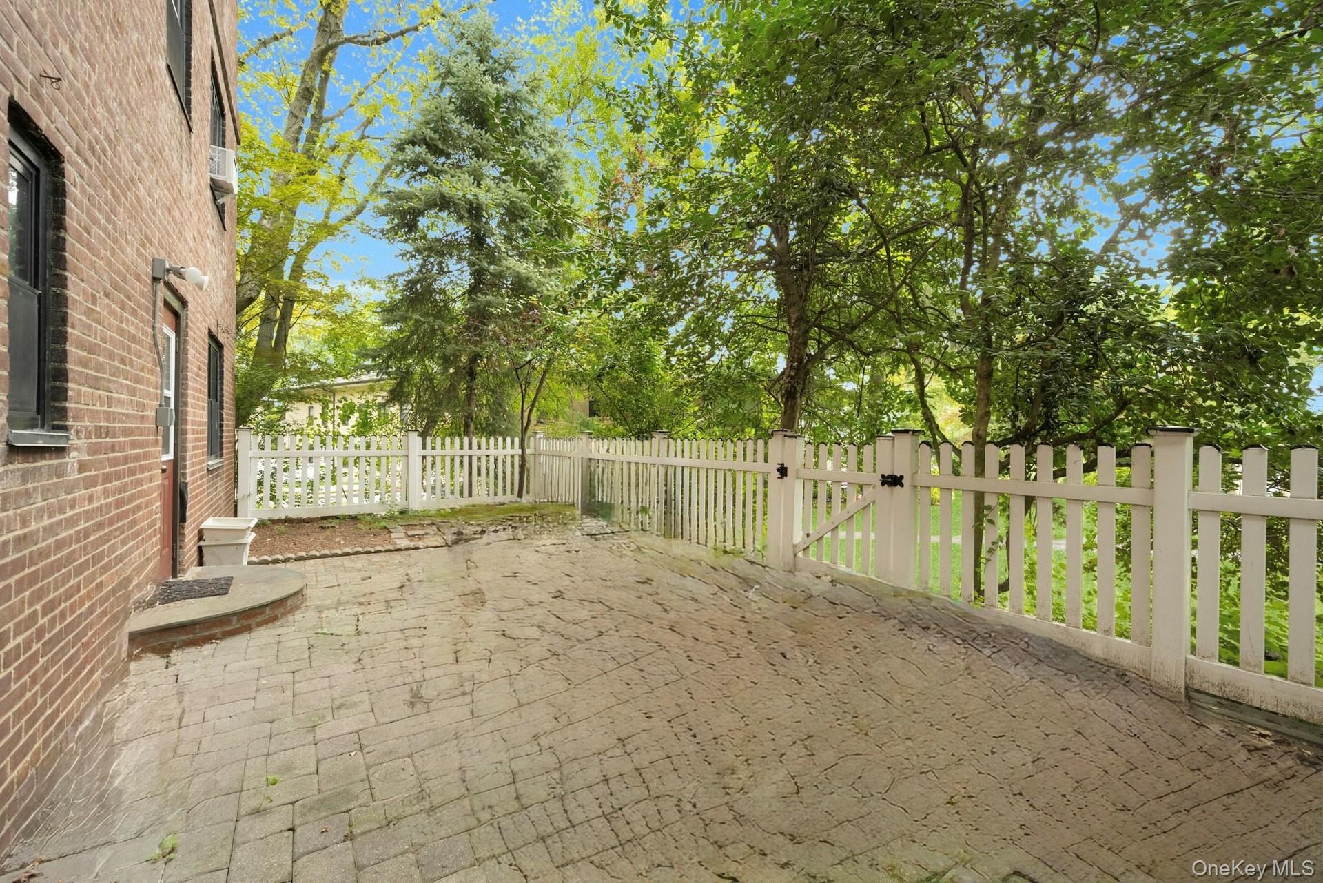 6 Manchester Road, Unit 1 Eastchester, NY 10709 - Photo 28 of 40 View of patio with a gate