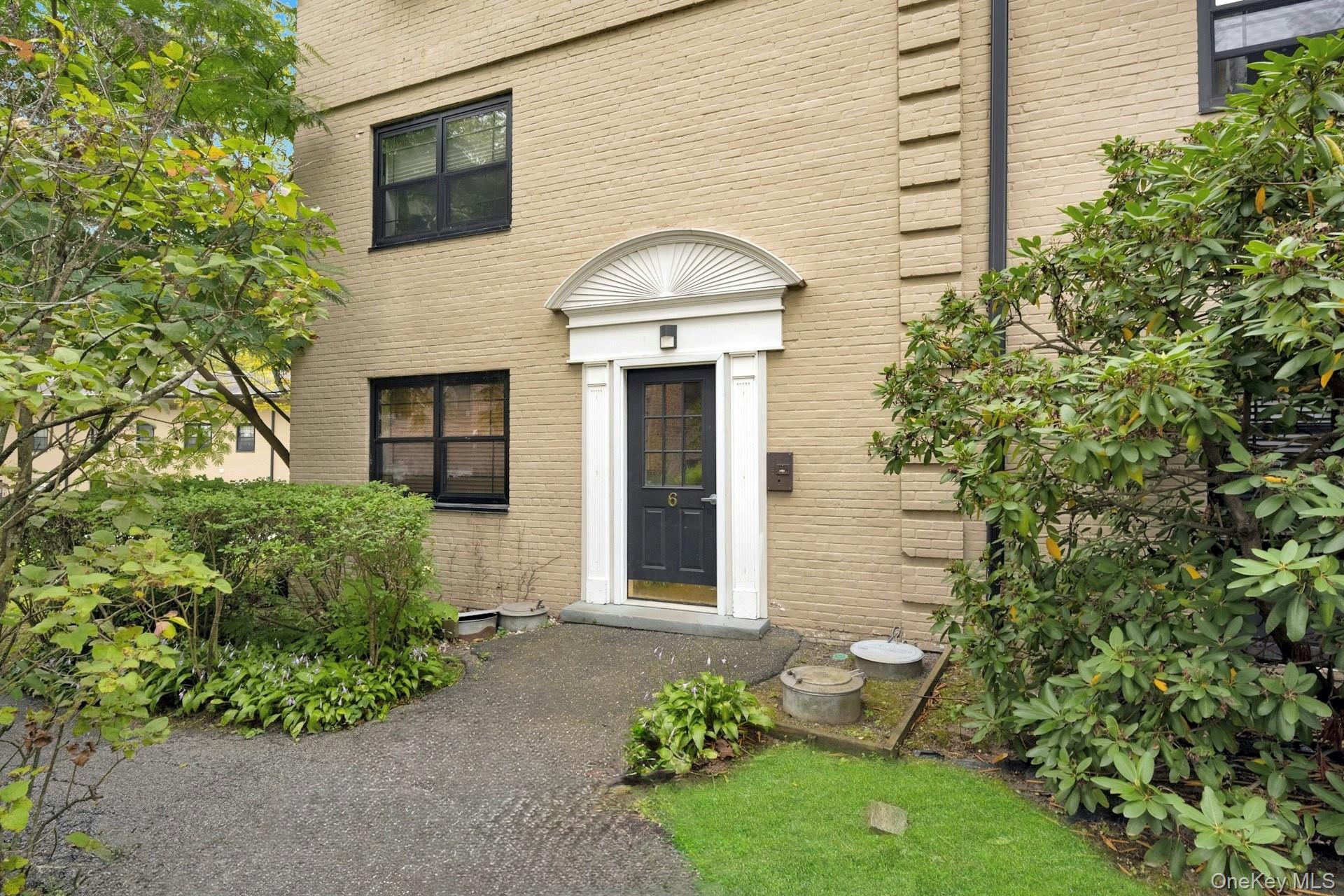 6 Manchester Road, Unit 1 Eastchester, NY 10709 - Photo 5 of 40 Doorway to property with brick siding