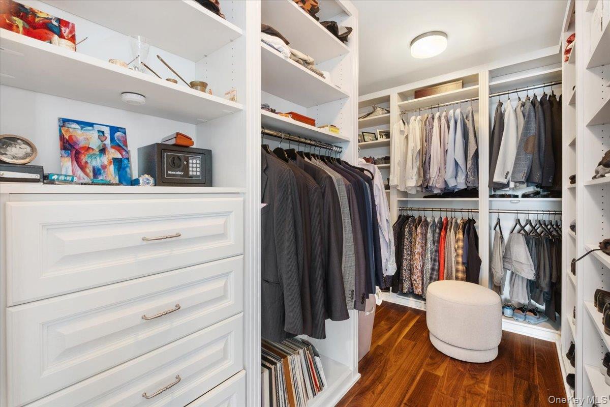 5 Renaissance Square, Unit PH 3E White Plains, NY 10601 - Photo 20 of 26 a view of walk in closet with clothes and shoes