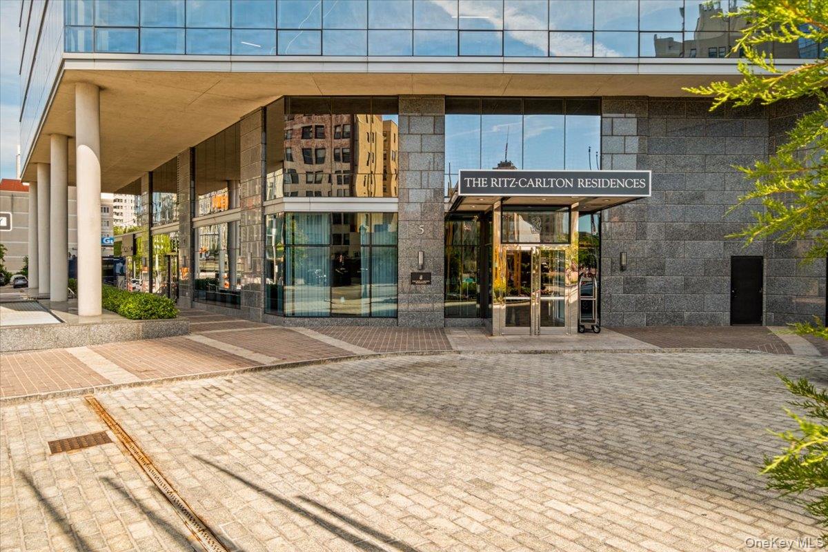 5 Renaissance Square, Unit PH 3E White Plains, NY 10601 - Photo 2 of 26 a view of a brick building with a large window
