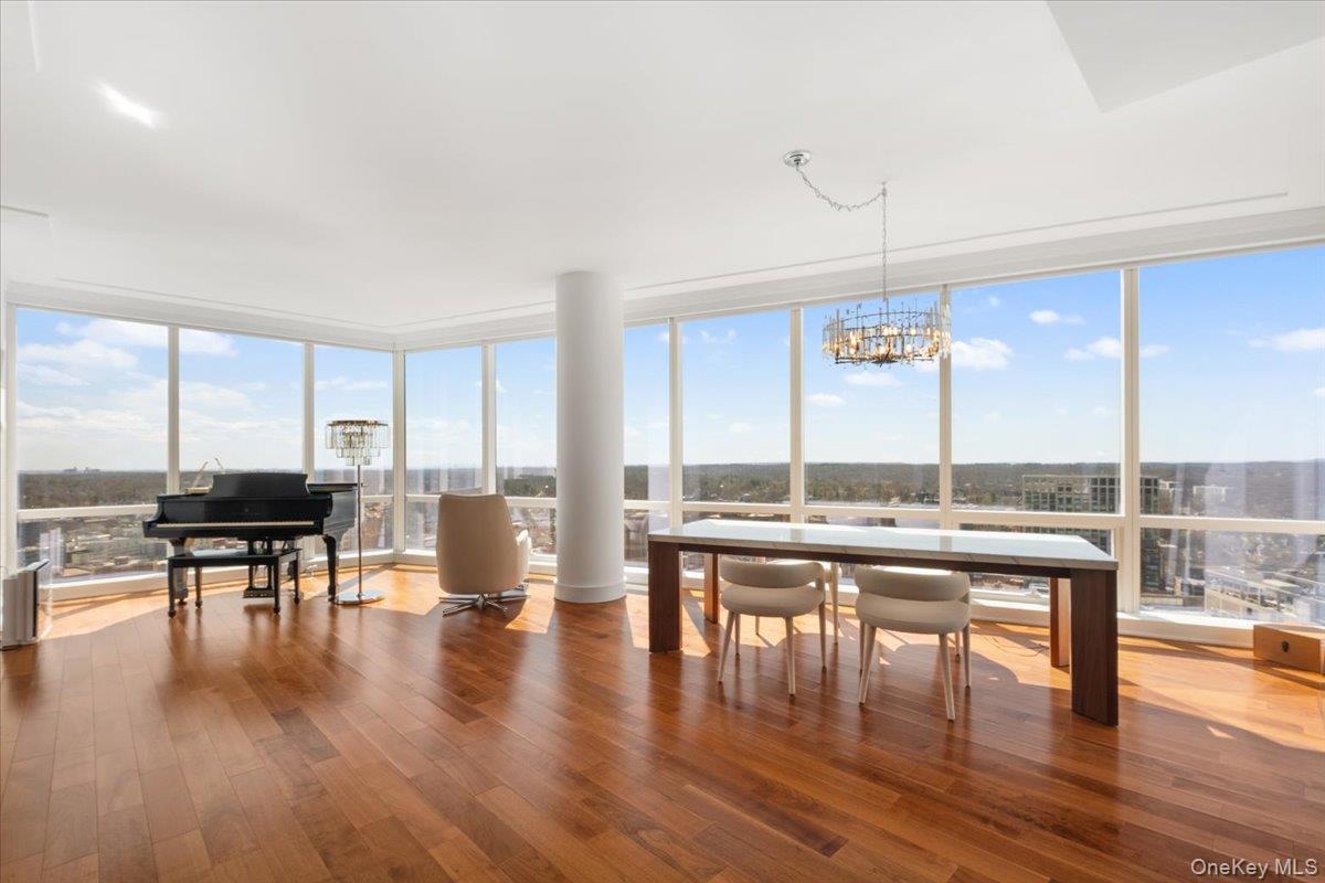 5 Renaissance Square, Unit PH 3E White Plains, NY 10601 - Photo 8 of 26 a view of a work space with wooden floor and furniture