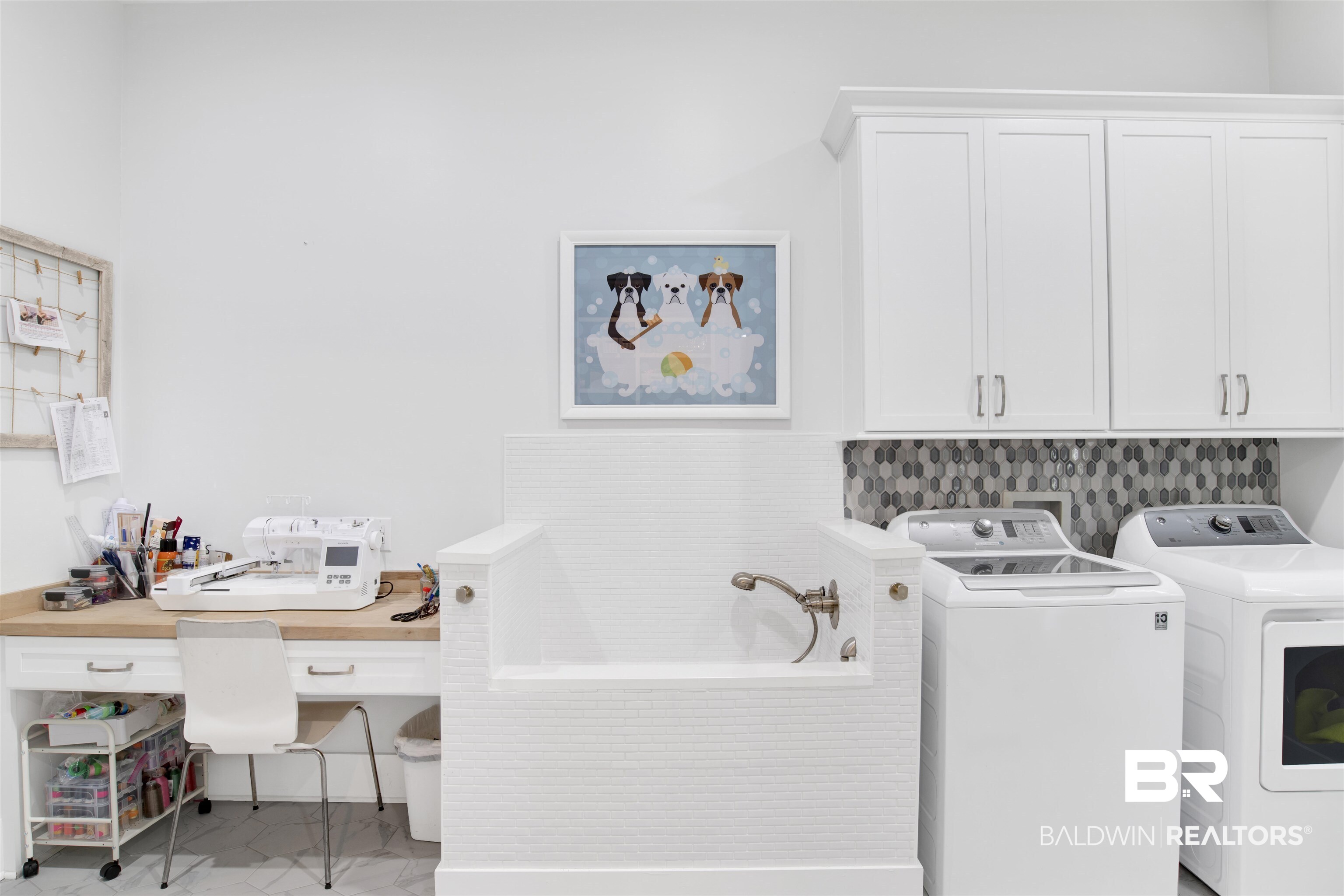 32937 River Road Orange Beach, AL 36561 - Photo 23 of 42 Laundry area with cabinets and independent washer and dryer
