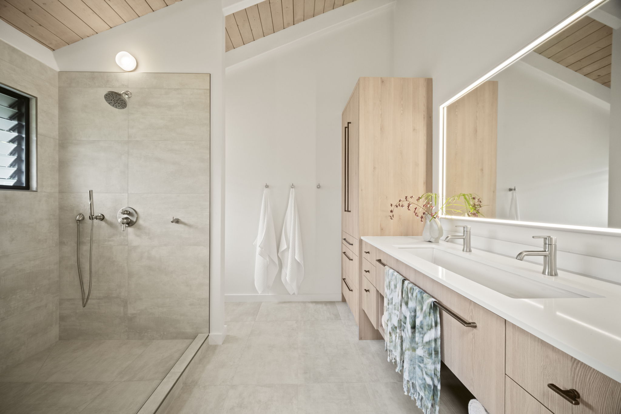4485 Pilikoa Street Hanalei, HI 96714 - Photo 17 of 28 a spacious bathroom with a double vanity sink a mirror and a shower