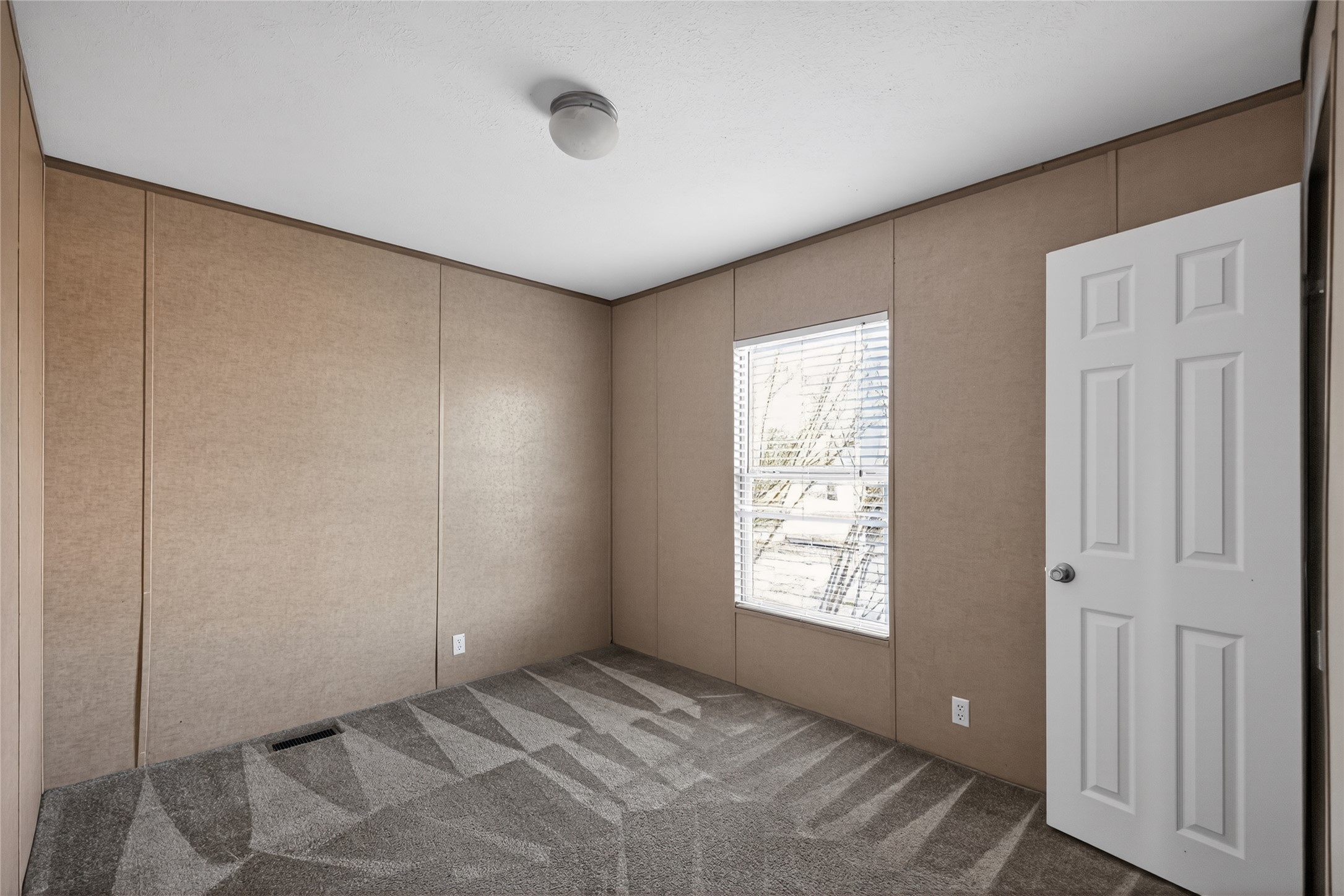 2674 Cotton Gin Road Kyle, TX 78640 - Photo 12 of 30 Carpeted spare room with a decorative wall