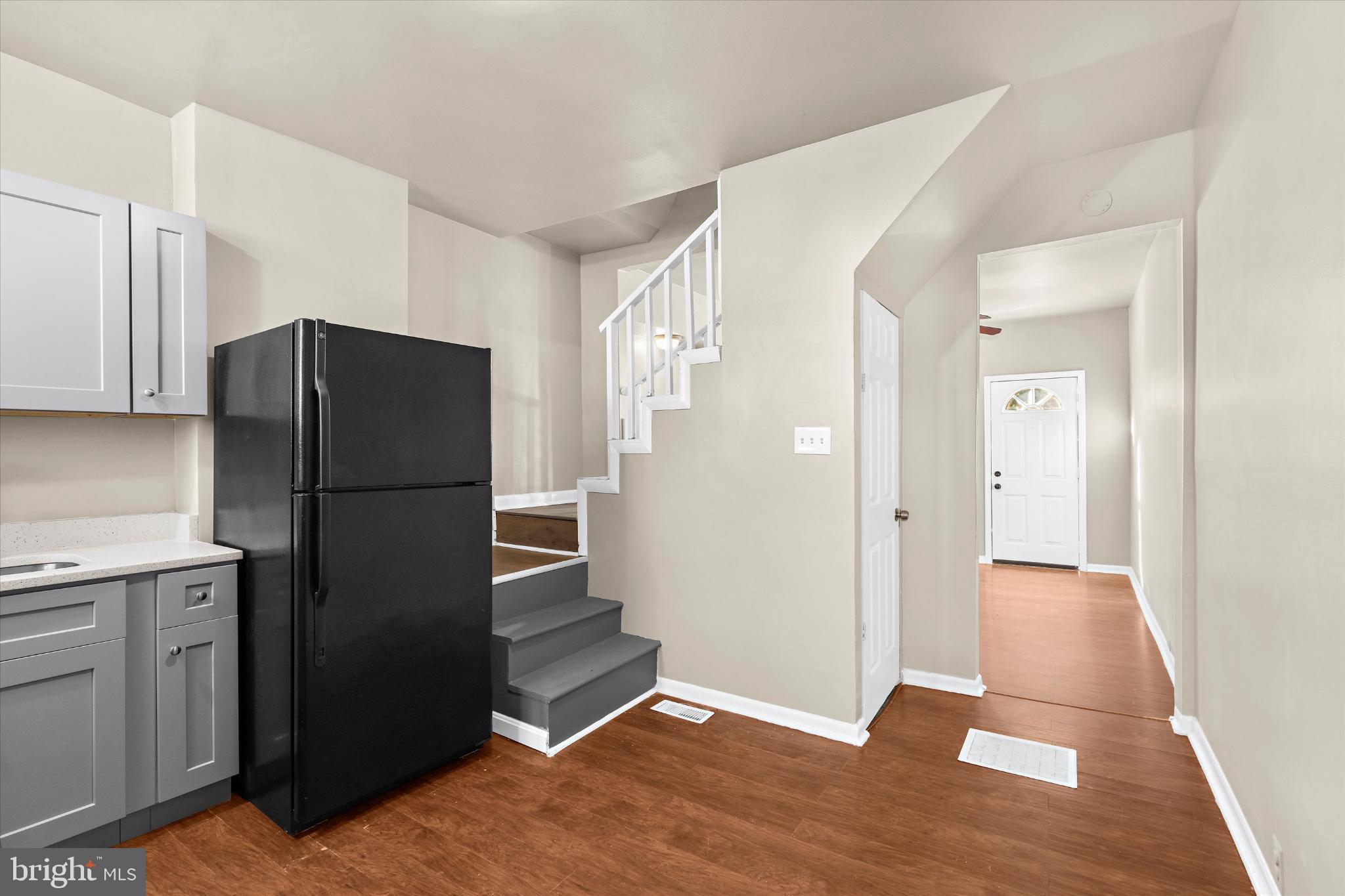 406 Cambria Street Baltimore, MD 21225 - Photo 11 of 26 a kitchen with a refrigerator and a sink
