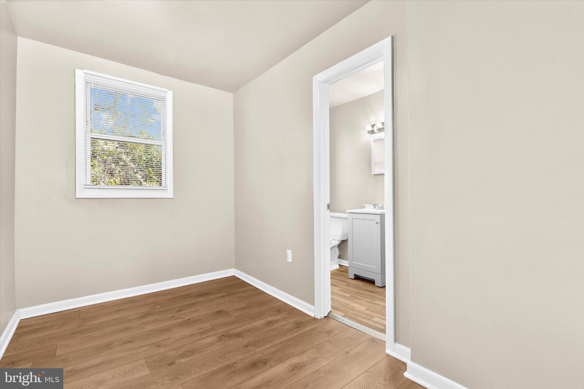 406 Cambria Street Baltimore, MD 21225 - Photo 16 of 26 a view of an empty room and bathroom