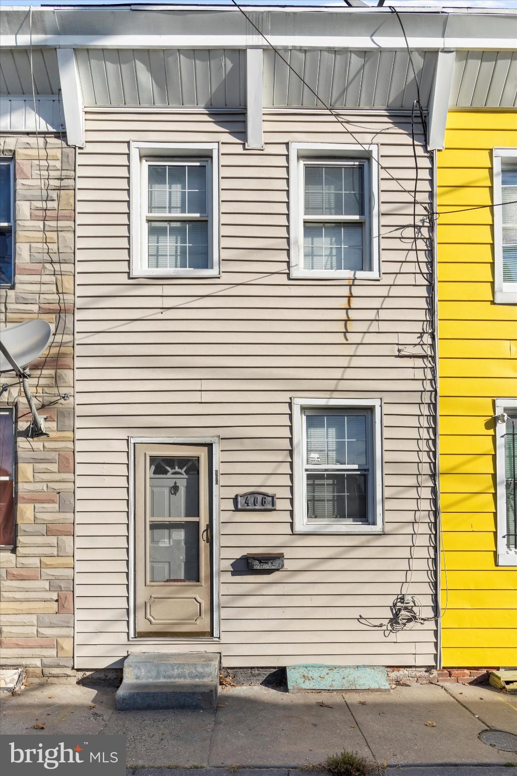 406 Cambria Street Baltimore, MD 21225 - Photo 2 of 26 a view of a house that has a car parked on the road