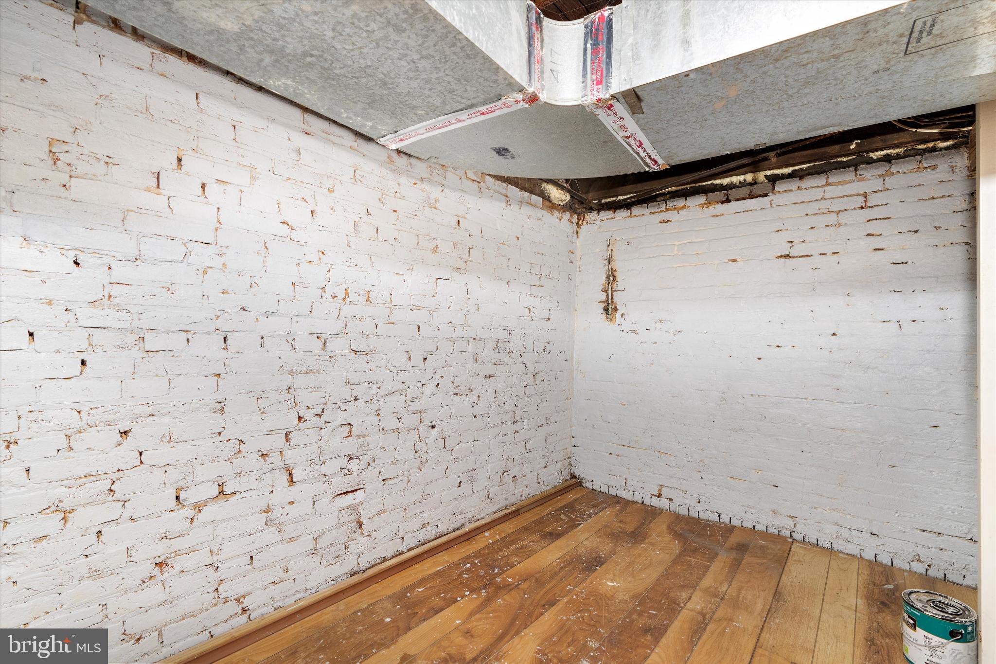 406 Cambria Street Baltimore, MD 21225 - Photo 21 of 26 a view of a room with wooden floor