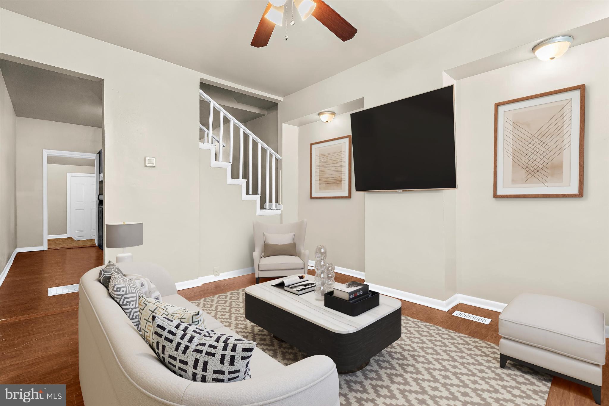 406 Cambria Street Baltimore, MD 21225 - Photo 4 of 26 a living room with furniture and a flat screen tv