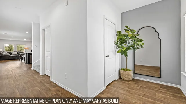 a view of a hallway with a potted plant
