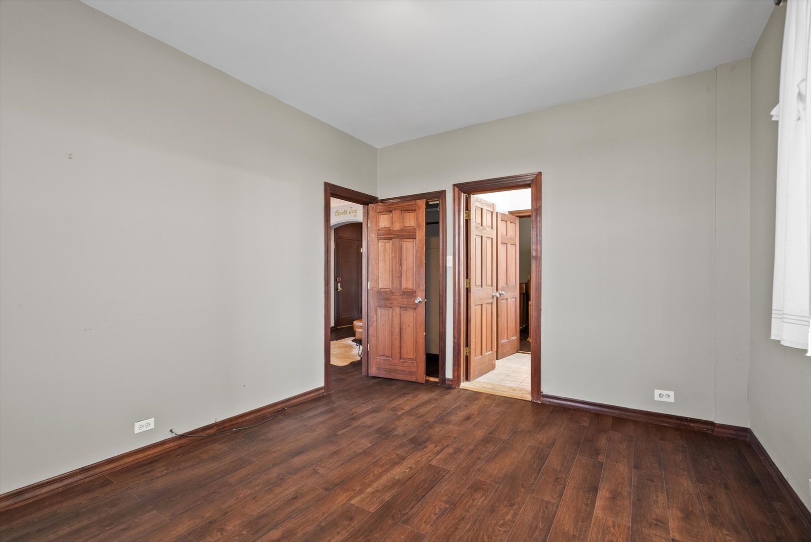 6101 North Sheridan Road, Unit 14C Chicago, IL 60660 - Photo 15 of 20 an empty room with wooden floor and closet